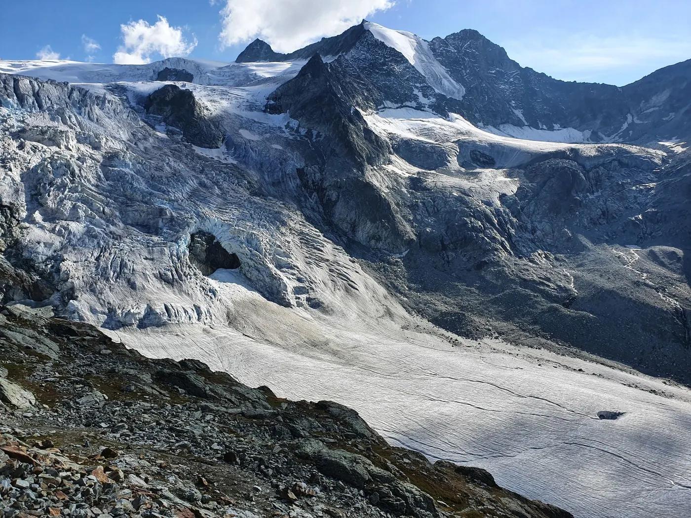 Stunning alpine glacier scene in Anniviers, Switzerland, showcasing rugged mountain terrain and icy peaks.