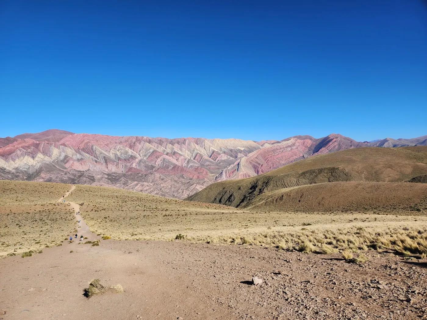 Stunning view of the vibrant Serrania de Hornocal mountains under a clear blue sky in Jujuy, Argentina.