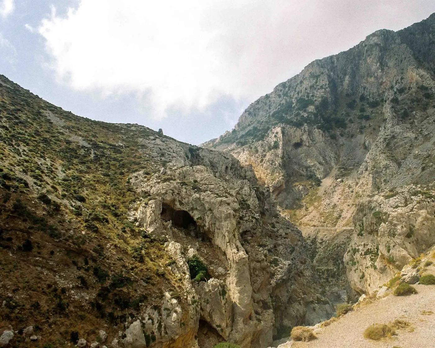 Explore the eroded rocky landscape and mountains of Greece, capturing natural beauty.
