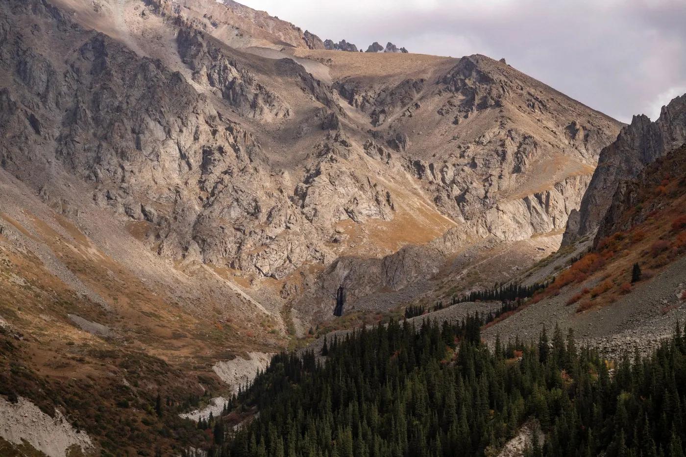 Explore the breathtaking mountain range in Kyrgyzstan showcasing autumn colors.